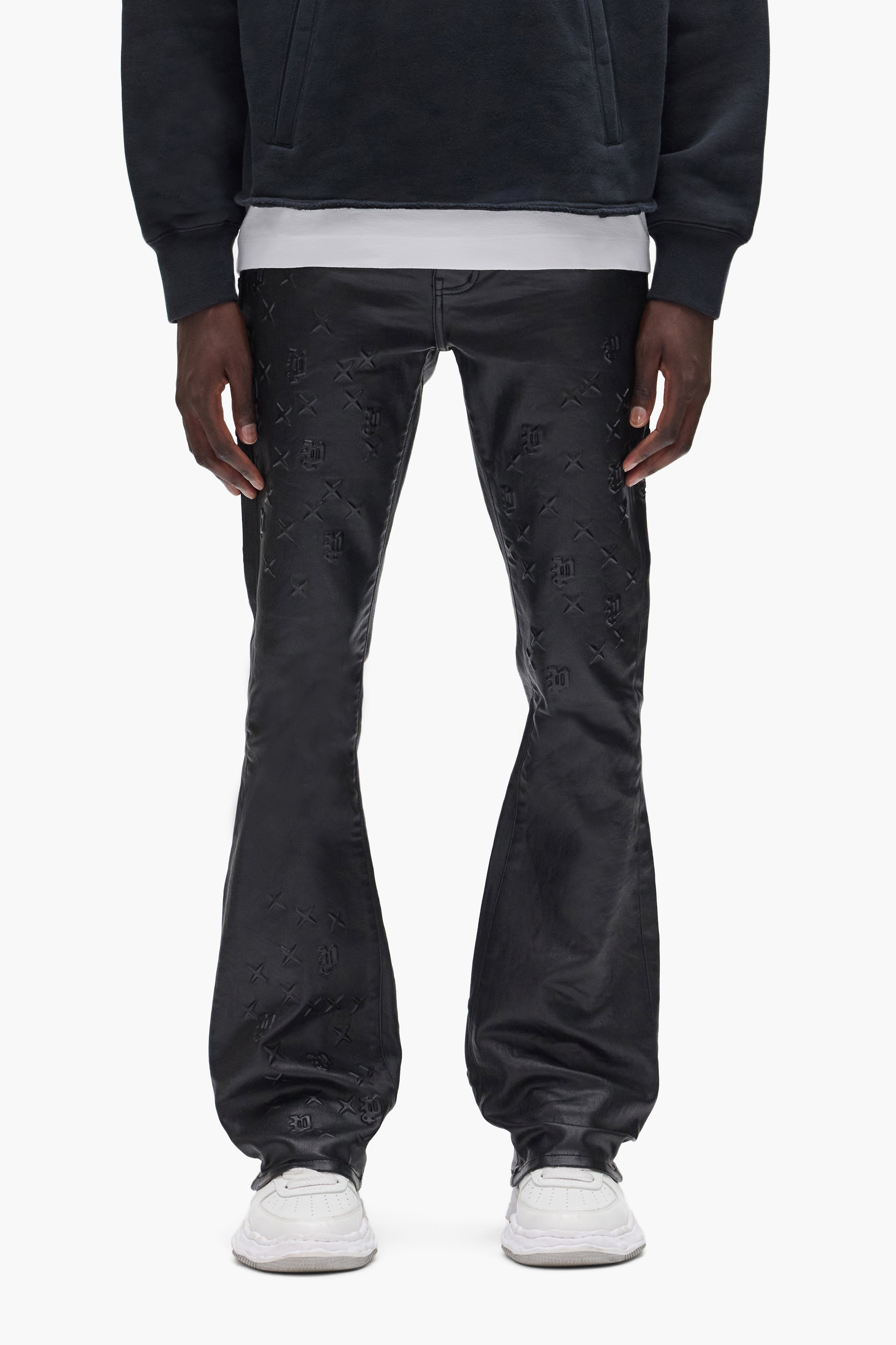 P004 Monogram Embossed pants in premium stretch denim, low rise, available in various sizes.